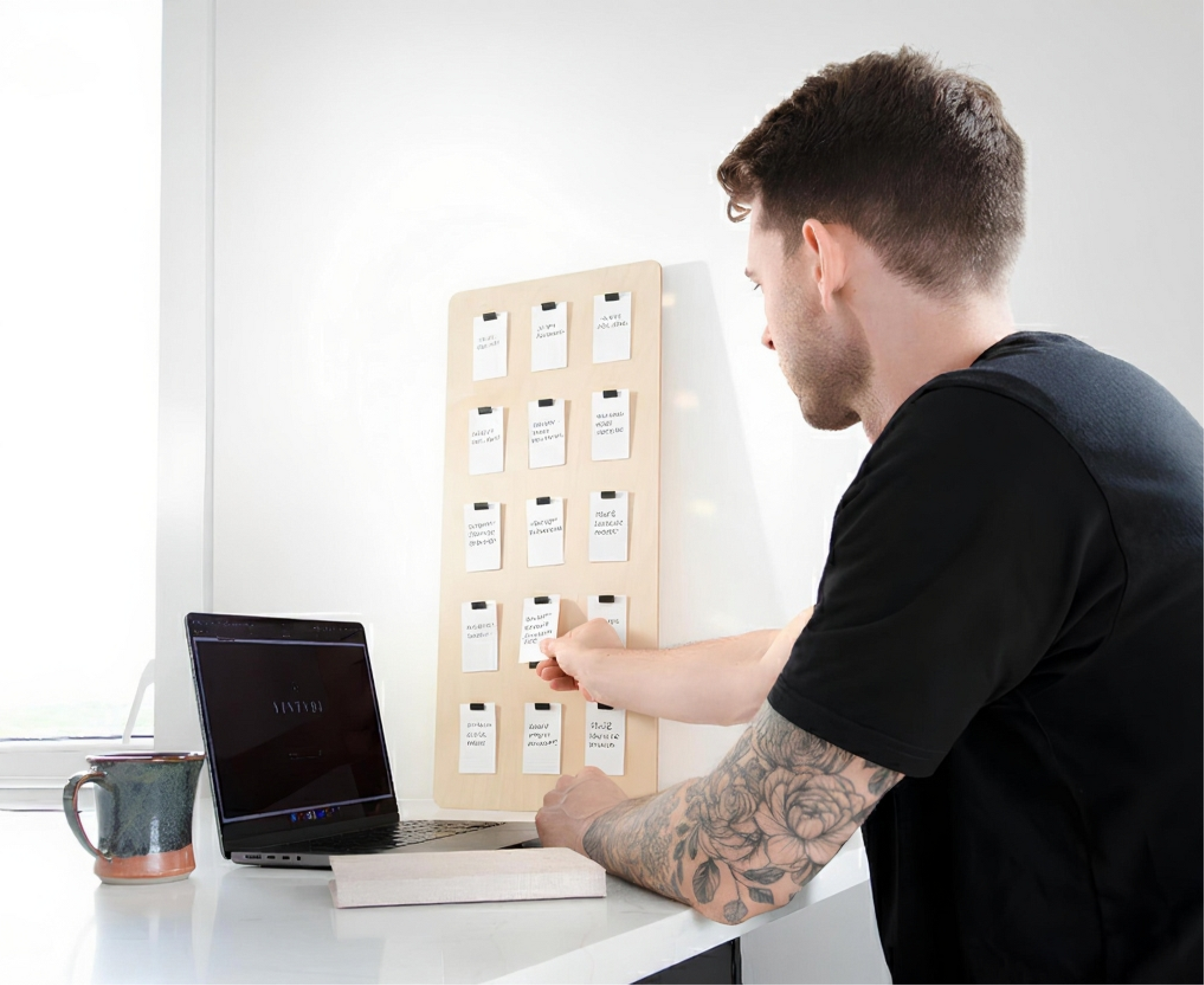 Clean Scandinavian workspace with Raymes board